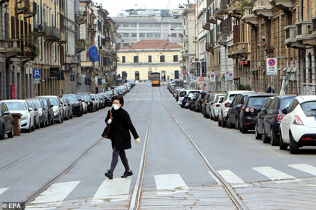 Italy's coronavirus death toll has skyrocketed by 756 in one day, bringing the country's total fatalities to 10,779. Pictured: The nearly deserted streets of Milan