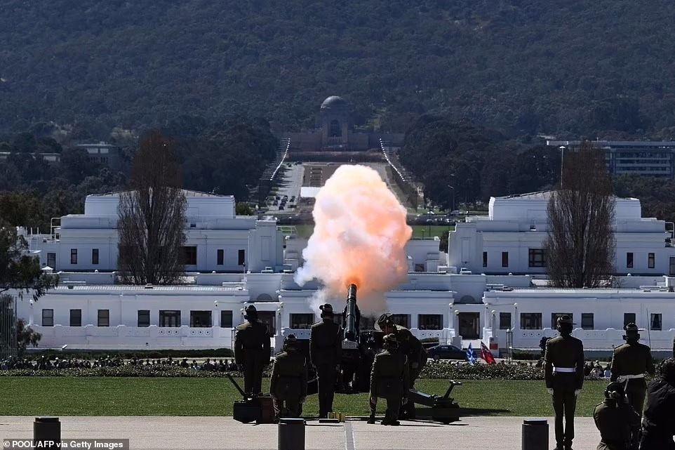 Members of the Australian Defence Force conduct a 21 gun salute at Parliament House in Canberra