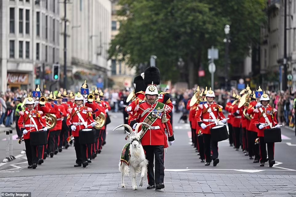 The 3rd battalion of the Royal Welsh and The Band of the Royal Welsh arrive at Cardiff Castle accompanied by the regimental mascot during of the Welsh Proclamation of King Charles III