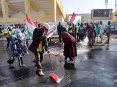 PDP Members Clean Up Jos City After APC Campaign Rally