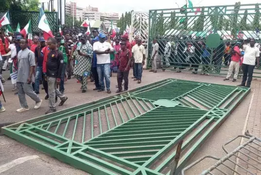 Protesters Pull Down NASS Gate, Take Over Premises (Photos, Video) Protesters Pull Down NASS Gate, Take Over Premises (Photos, Video)