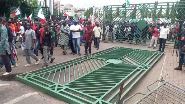 Protesters Pull Down NASS Gate, Take Over Premises (Photos, Video) Protesters Pull Down NASS Gate, Take Over Premises (Photos, Video)