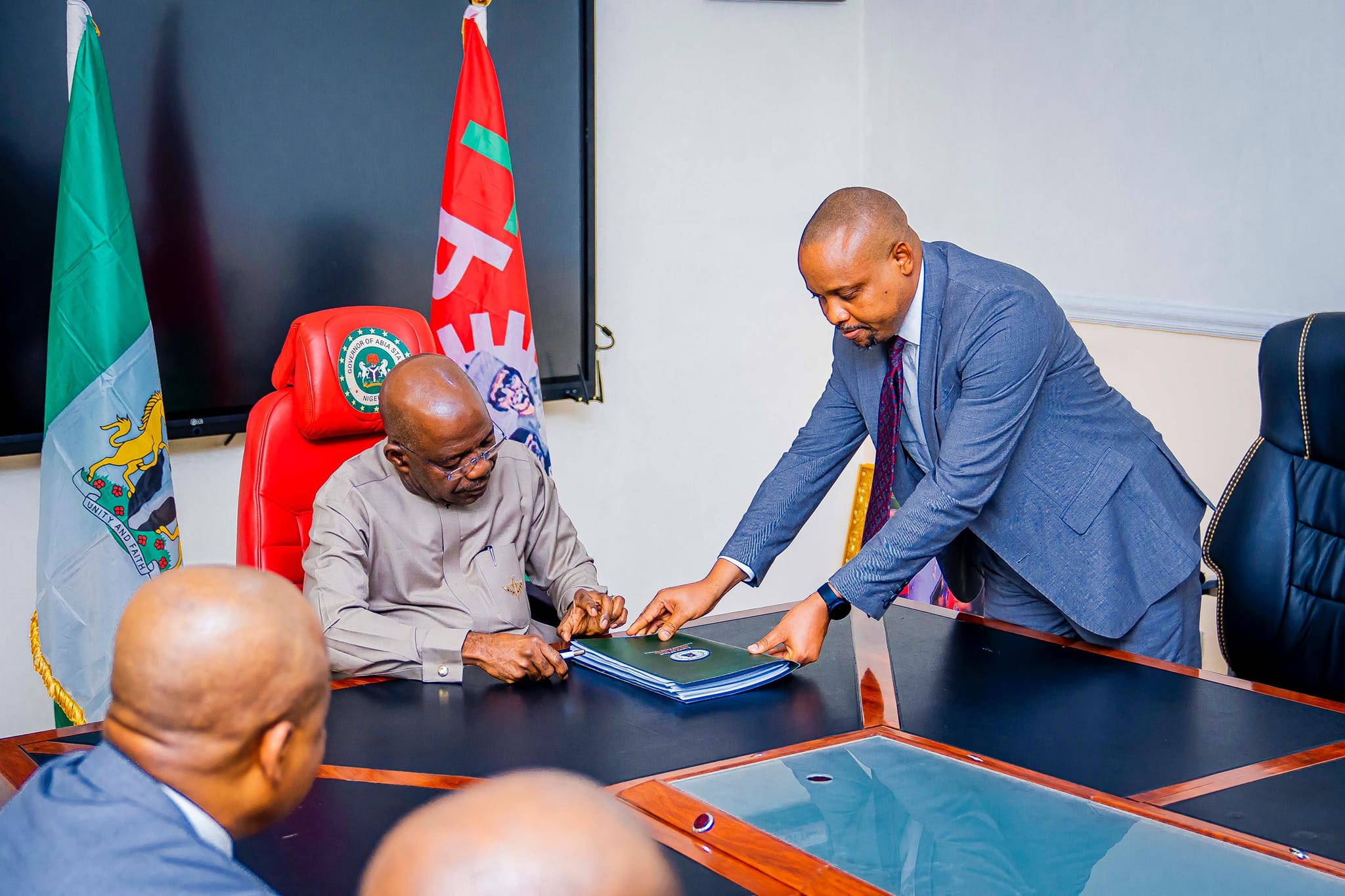 Attorney-General, Ikechukwu Uwanna, presenting the bill passed by the House of Assembly to Governor Otti for assent.