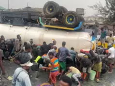 Tanker Loaded With Oil Overturns Content In Lagos, Residents Rush To Scoop