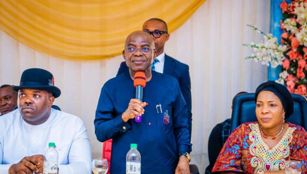 Governor Otti, speaking at the meeting with party stakeholders. With him, sitting left are the Deputy Governor, Ikechukwu Emetu, and Wife of the Governor, Mrs. Priscilla Otti.
