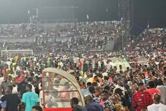 Violence Erupts At Enugu Stadium As Fans Storm Pitch Over Controversial Penalty (Photos, Video) Violence Erupts At Enugu Stadium As Fans Storm Pitch Over Controversial Penalty (Photos, Video)