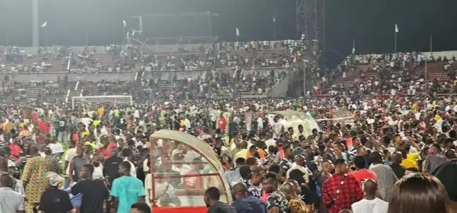 Violence Erupts At Enugu Stadium As Fans Storm Pitch Over Controversial Penalty (Photos, Video) Violence Erupts At Enugu Stadium As Fans Storm Pitch Over Controversial Penalty (Photos, Video)