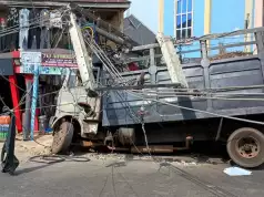 Truck Loses Control, Crashes Into High-Tension Electric Poles, Shops In Umuahia (Photos, Video) Big Truck Loses Control, Crashes Into High-Tension Poles, Shops In Umuahia (Photos, Video)