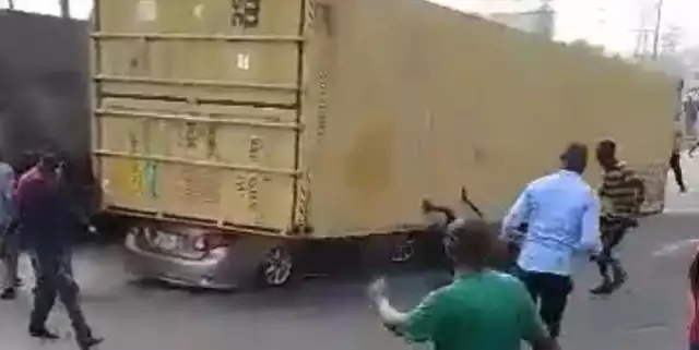Tragedy Averted: Container Falls On Car In Lagos, Driver Escapes Death (Photos, Video) Tragedy Averted: Container Falls On Car In Lagos, Driver Escapes Death (Photos, Video)