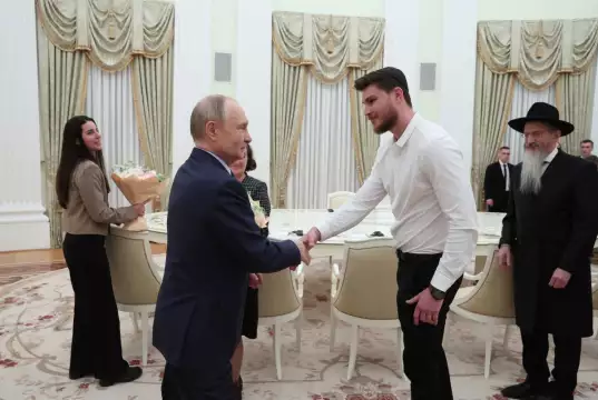 Putin Meets With Freed Russian-Israeli Hostage Putin Meets With Freed Russian-Israeli Hostages