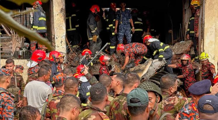 Bangladesh’s fire service and security personnel Bangladesh Fighter Jet Crashes Into School, Kills19