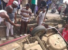 Woman Cheats Death As Car Somersaults Into Erosion Pit In Aba (Photos) Woman Cheats Death As Car Somersaults Into Erosion Pit In Aba (Photos