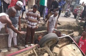 Woman Cheats Death As Car Somersaults Into Erosion Pit In Aba (Photos) Woman Cheats Death As Car Somersaults Into Erosion Pit In Aba (Photos