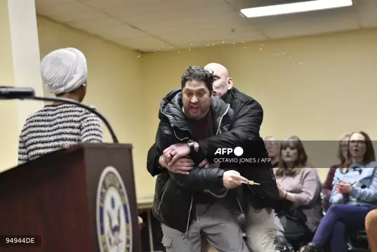 US Rep. Ilhan Omar Sprayed with Unknown Substance During Minneapolis Town Hall; Suspect Arrested US Rep. Ilhan Omar Sprayed with Unknown Substance During Minneapolis Town Hall; Suspect Arrested